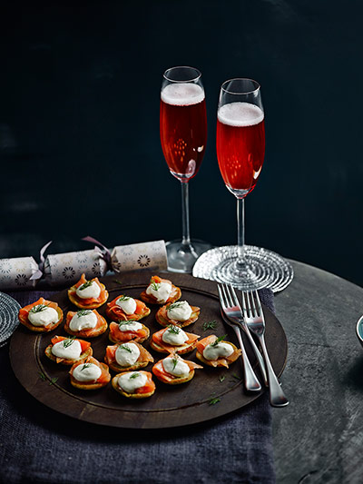 John Lewis Dec gallery: John Lewis: smoked salmon canapés with two glasses of cranberry fizz