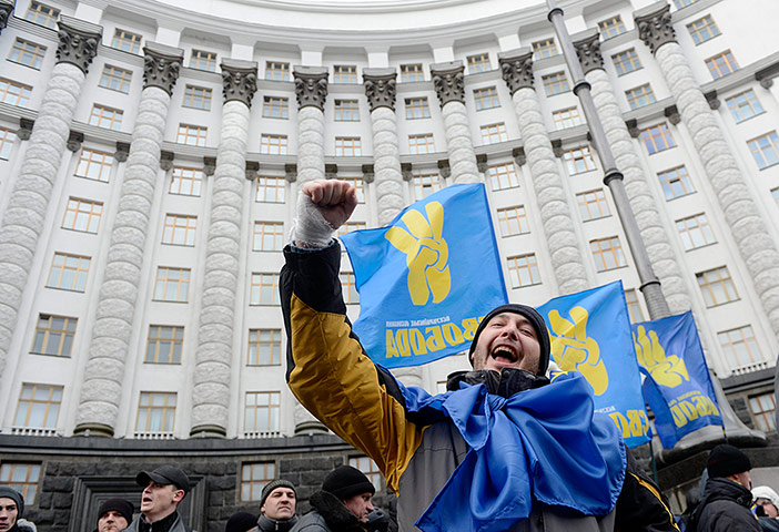 Ukraine update: A protester shouts slogans while blocking the Cabinet of Ministers building