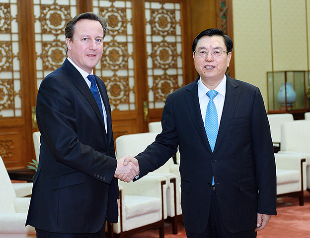 David Cameron in China: Zhang Dejiang and David Cameron shake hands