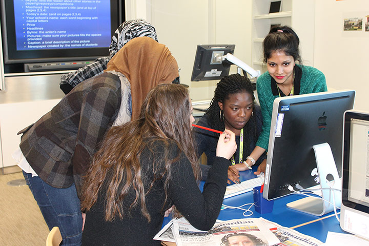 Ed Centre Editorial teams: One team closely examines their front page before sending it to print