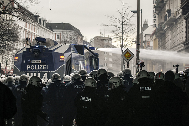 Weekend in pictures: Hamburg, Germany: Police use water-cannons in an attempt to drive back demo