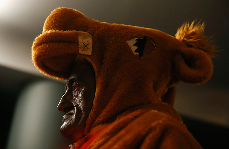 Weekend in pictures: Madrid, Spain: A man dressed in a costume attends the draw for Spain's El G