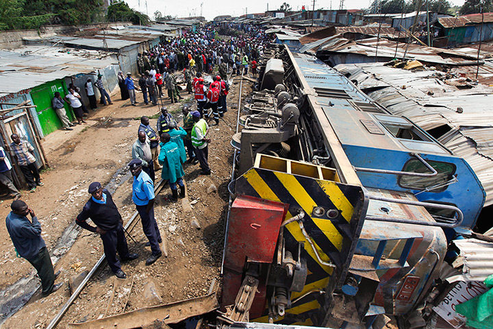 Weekend in pictures: Nairobi, Kenya: Police officers and rescue workers gather around a derailed