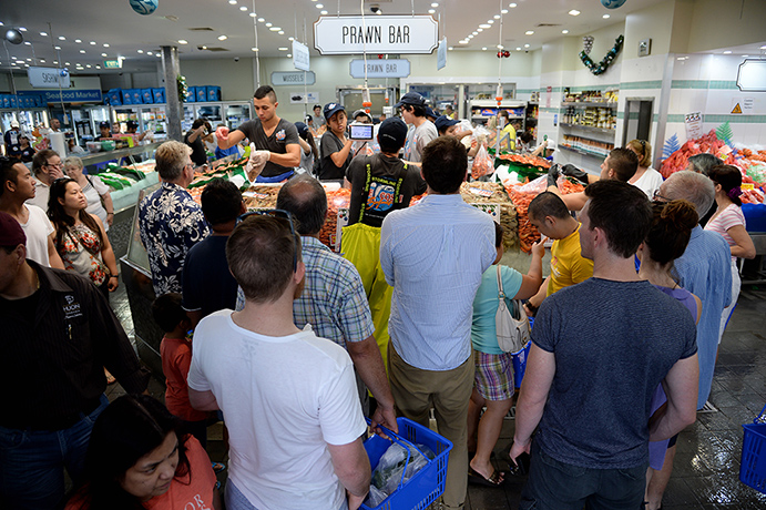 Fish Market: Customers line up early to buy seafood