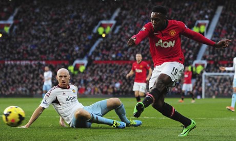 Danny Welbeck of Manchester United scores the opening goal in the match against West Ham