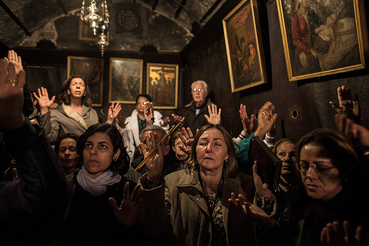 Top ten: Bethlehem: Pilgrims pray inside the Grotto where Christians believe the Vir