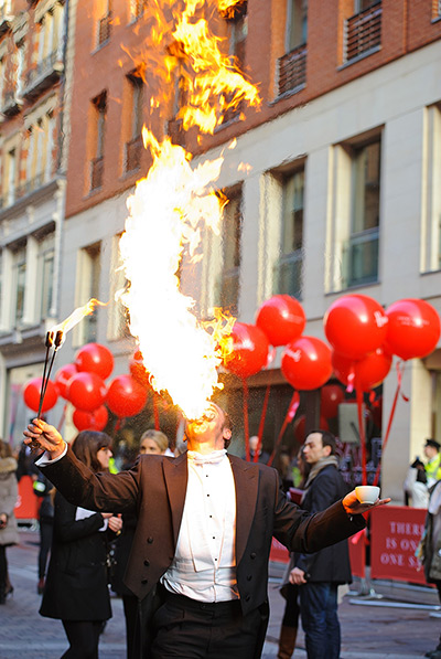 Boxing day sales: Performers entertain the shoppers queuing at Harrods