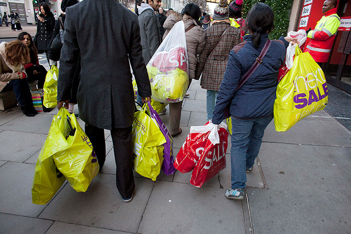 Boxing Day Sales Update: Shoppers with their haul on Oxford Street in London