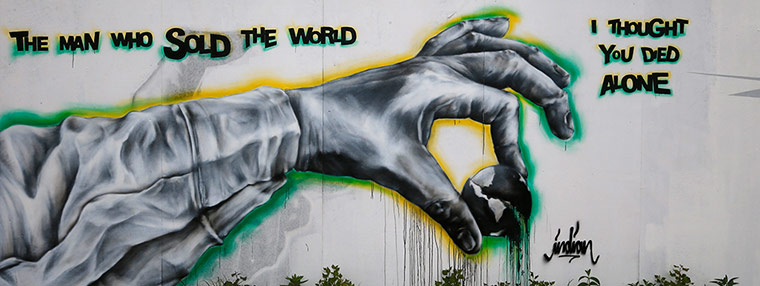 Graffiti: Another piece of anti-capitalist graffiti is seen on the fences surrounding