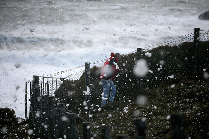 10 photo highlights: Spume is blown inland by gale force winds in Trearddur Bay, Anglesey