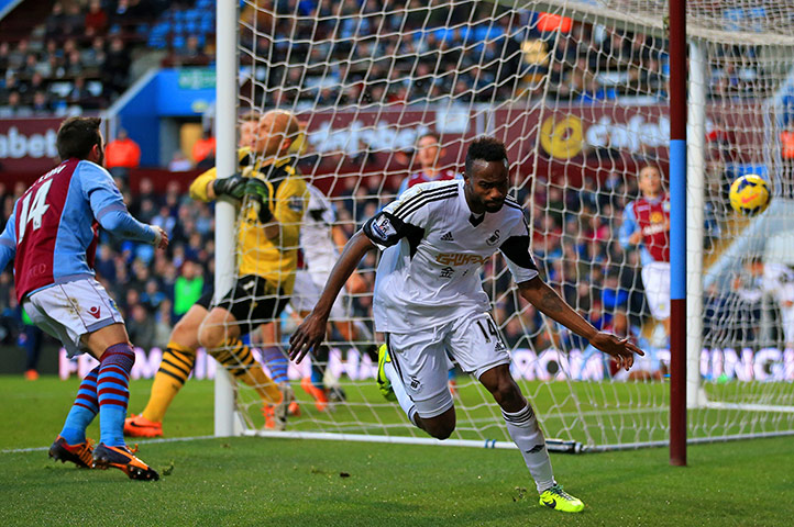 premier league: Roland Lamah celebrates