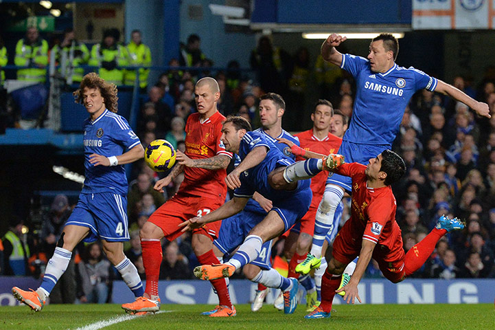 football-: The ball heads goalward from a header by