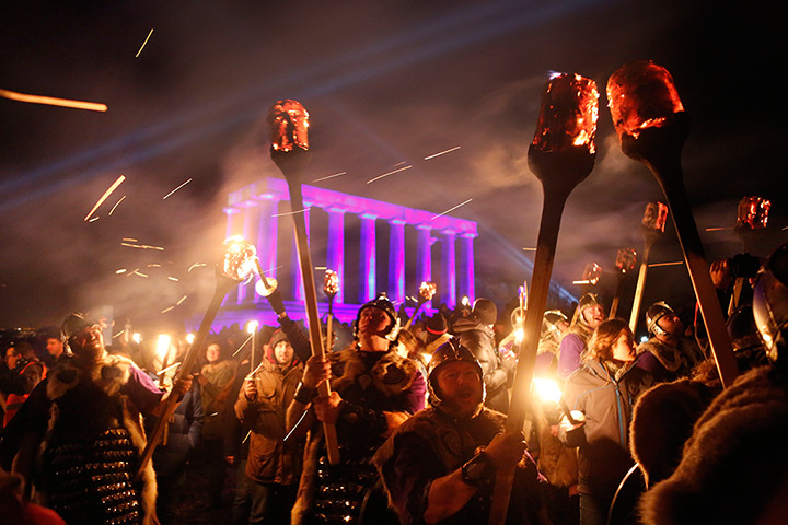 Photo highlights: Up Helly Aa Vikings take part in a torchlight procession on the first night