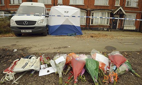 Floral tributes near police forensic tent covering spot where Joshua Folkes was killed