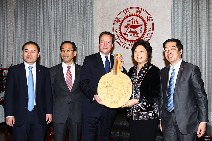Cameron update: David Cameron with giant ping pong bat