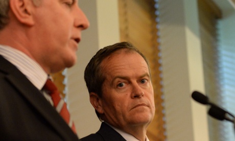 Opposition leader Bill Shorten listens to shadow employment minister Brendan O'Connor during his Qantas press conference.