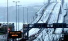 The Forth road Bridge was closed to all traffic at rush hour this morning due to storms. See more pictures of extreme weather in the UK in our gallery.