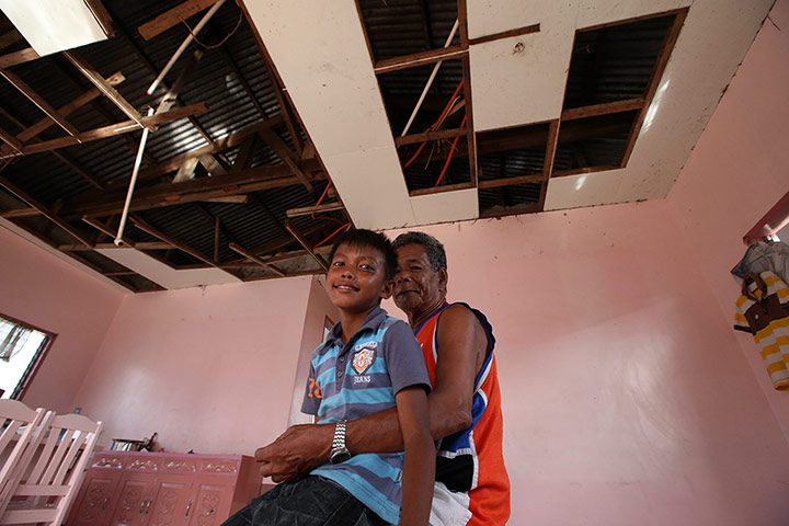 Joshua Cator: Joshua Cator sits on his grandfather Sulpicio Sr.'s lap