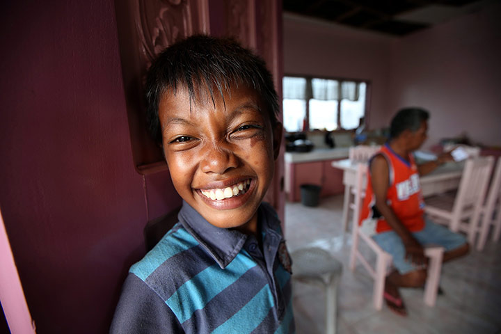 Joshua Cator: Joshua smiles inside their temporary shelter