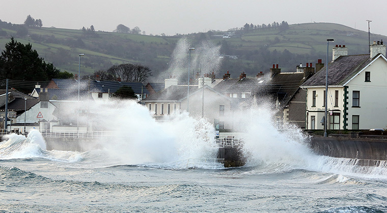 Weather update: High winds and sea batter the Antrim coast road in Co Antrim. 