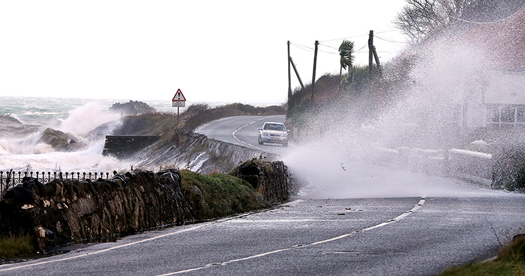 Weather update: High winds and sea batter the Antrim coast road in Co Antrim. 