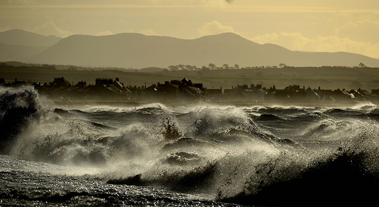 Weather update: The village of Allonby in the Lake District in Cumbria as heavy seas and hi