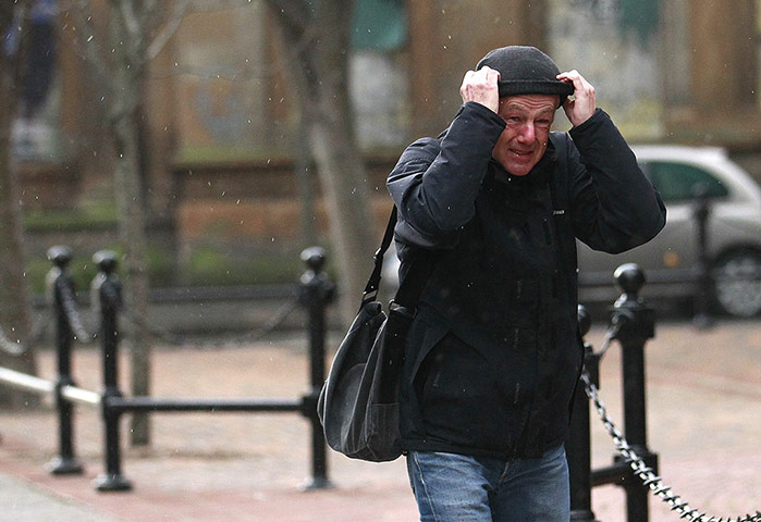Weather gallery update: A man braves the elements in Belfast
