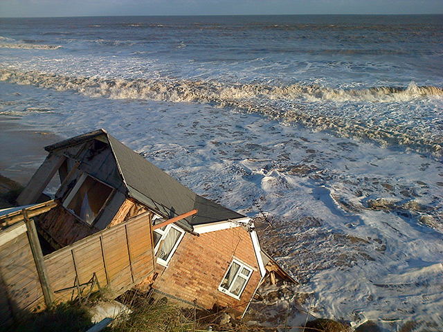 Weather : In Hemsby, 30ft of sand dune and cliff was washed away by the storm surge. 