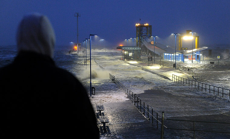 Storm Xaver in Europe: Waves lash the ferry pier on the North Sea coast in Dagebuell, Germany