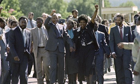 Nelson and Winnie Mandela acknowledge the crowds cheering his release on 11 February 1990
