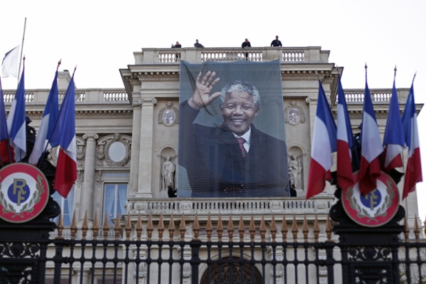 A banner with the image of Mandela is hung outside the Quai d'Orsay foreign Ministry, in Paris.