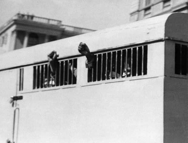 The prison van containing eight men, including Mandela, leaves the Palace of Justice in Pretoria after the group was sentenced to life imprisonment in the Rivonia trial in 1964.