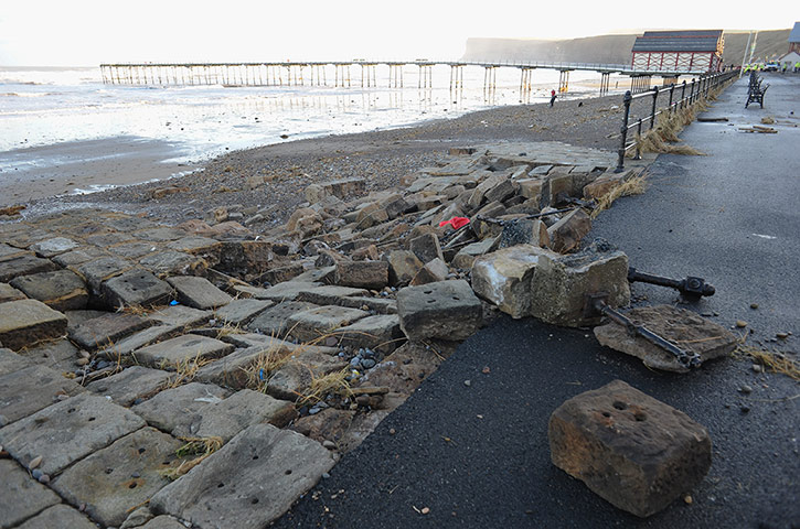 Uk weather update 2: Rocks from a slipway, broken apart by large waves in Saltburn