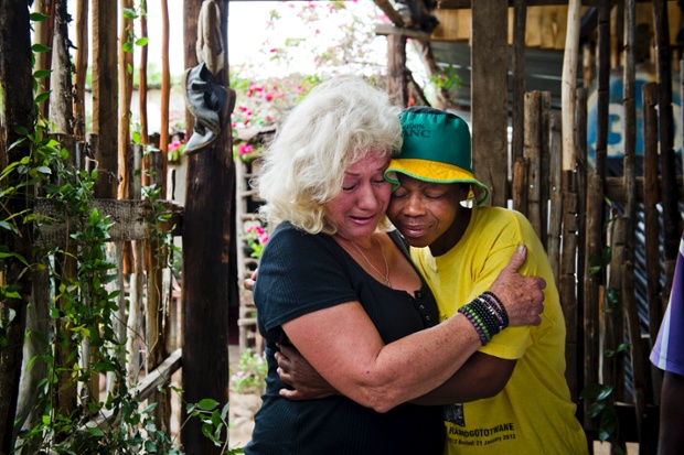 Jeanne Silver and Ninifa Mothoa of Freedom Walls mourne the death of Mandela in Johannesburg.