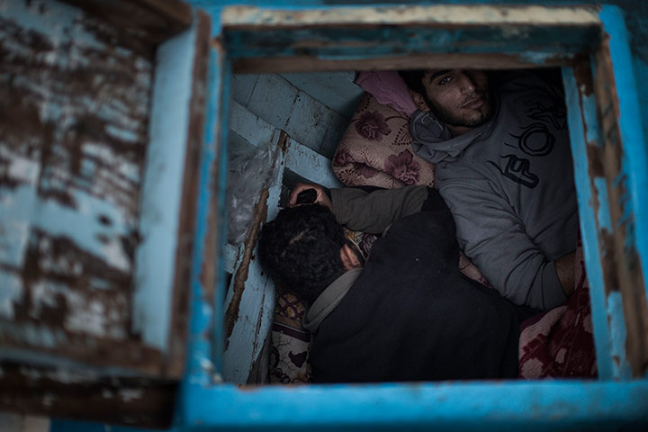 Gaza fishermen: Fishermen rest below deck