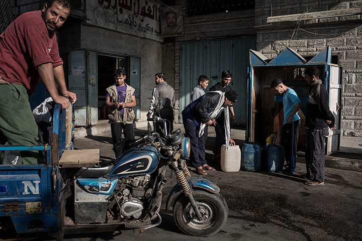 Gaza fishermen: Buying diesel to fuel the all-night fishing trip.
