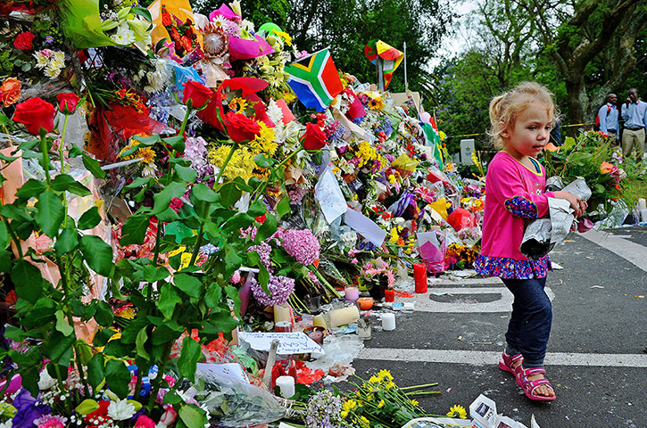 Celebrate Nelson: Leila de Wet walks past a wall of flowers