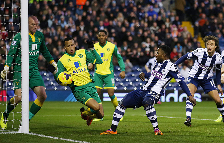 Prem Roundup: Norwich's Martin Olsson appears to stop the ball with his arm as West Brom'