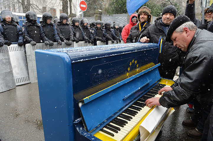 Ukrainian Protests man plays on a piano