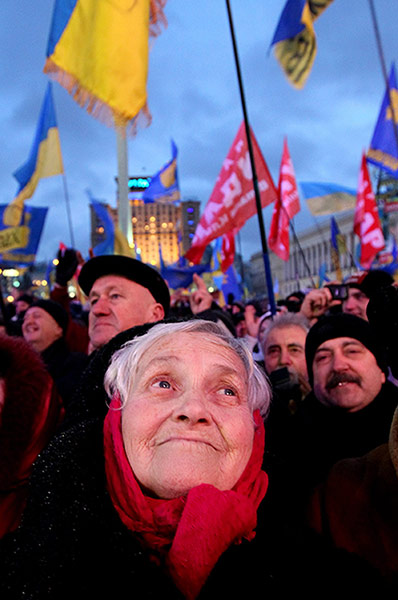 Ukrainian protests elderly lady flags thousands protesters rally independence square