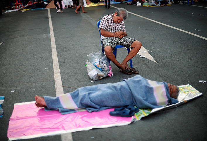 Weekend in pictures: Bangkok, Thailand: Anti-government protesters sleep as the sun rises on an 