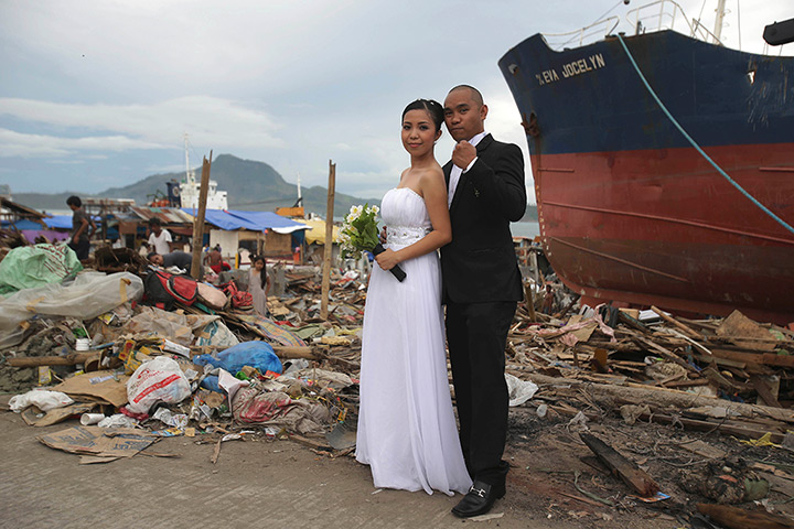 Weekend in pictures: Tacloban, central Philippines: A bride and groom pose for wedding photos in