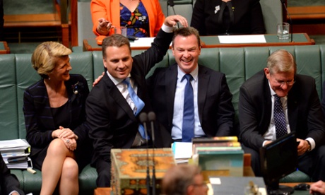 Foreign Minister Julie Bishop laughs as Jamie Briggs (centre) and Chris Pyne joke during question time in the House Of Representatives chamber at Parliament House Canberra Monday, Dec. 9, 2013. AAPIMAGE for The Guardian/Alan Porritt