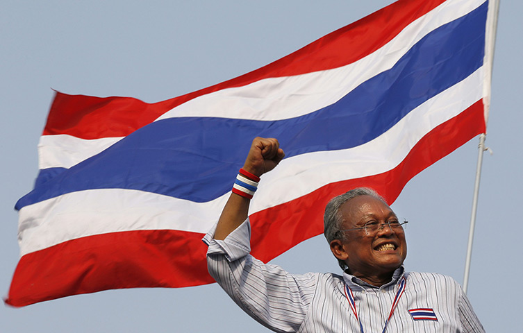 Thailand protests: Anti-government protest leader Suthep Thaugsuban gestures to thousands of c