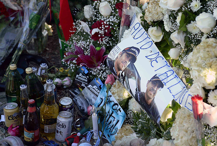 Paul Walker memorial: Photos, mementos and bottles of beer are placed at a makeshift memorial