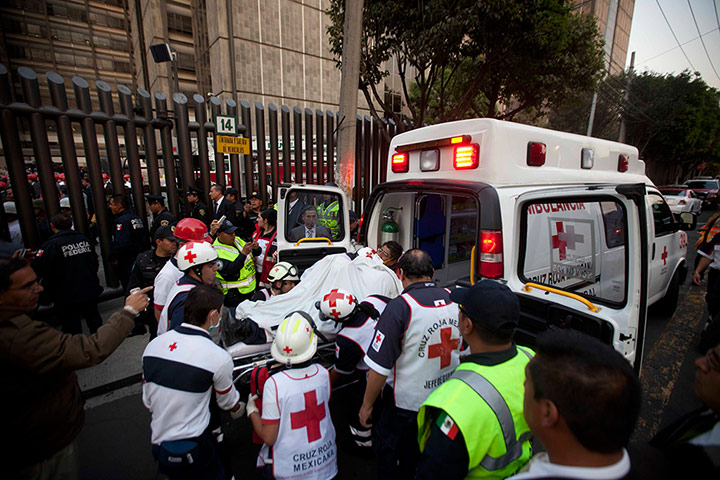 Mexico explosion: An injured person is carried into an ambulance