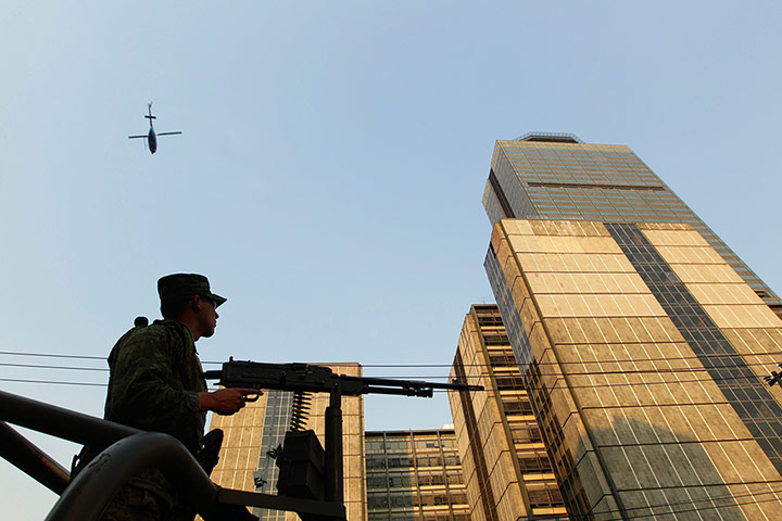 Mexico explosion: The Mexican army guard the Pemex building