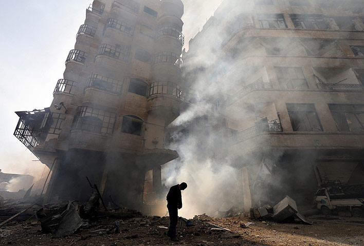 20 Photos: A burning building after a Syrian Air force air strike