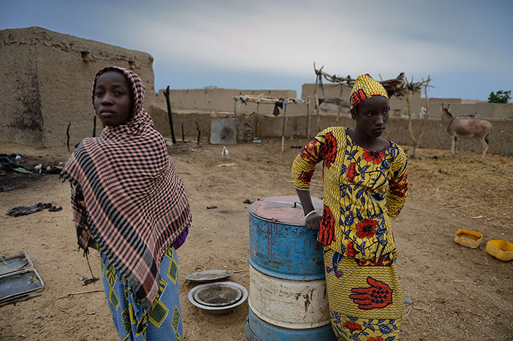20 Photos: Women stand by their house destroyed by a French airstrike in Lere, Mali