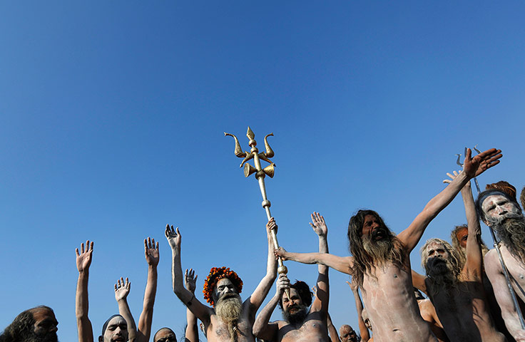 Maha Kumbh : A trident-shaped weapon is held aloft by sadhus at Sangam